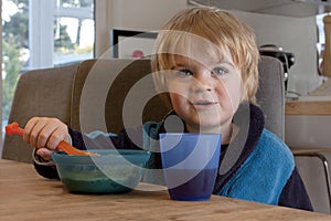 Toddler eating breakfast