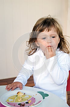 Toddler eating cake