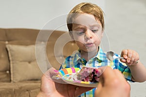 Toddler eating cake