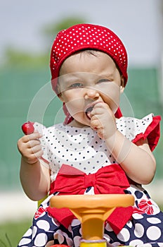 Toddler eating a cherry