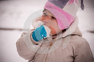 Toddler Eating Snow photo