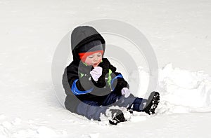 Toddler eating snow