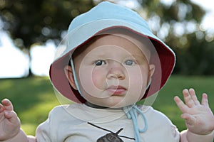 Toddler in floppy sun hat