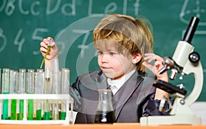 Toddler genius baby. Science concept. Gifted child and wunderkind. Kid study chemistry school lesson. School education