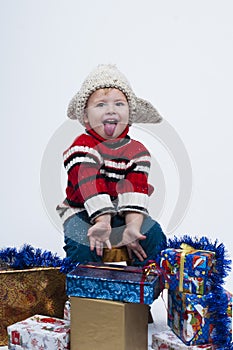 Toddler with gift boxes