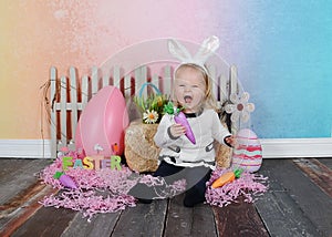 Toddler girl being silly at easter