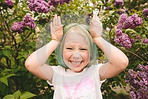 Toddler girl with green hair