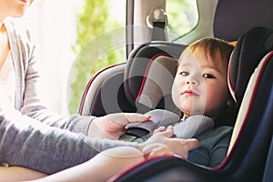 Toddler girl in her car seat