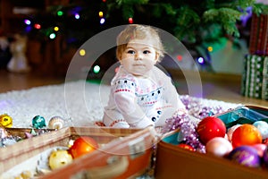 Toddler girl and kid boy playing table soccer with family at home. Smiling children, siblings play board football