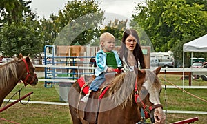 Toddler Girl with Mom First Pony Ride