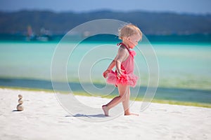 Toddler girl playing at beach