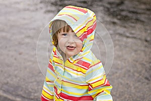 Toddler girl playing in the rain