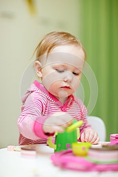 Toddler girl playing with toys