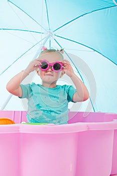 Toddler girl in swimming pool