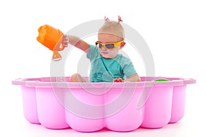 Toddler girl in swimming pool