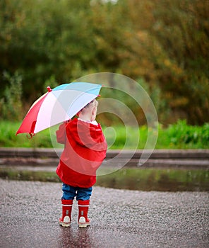 Toddler girl with umbrella