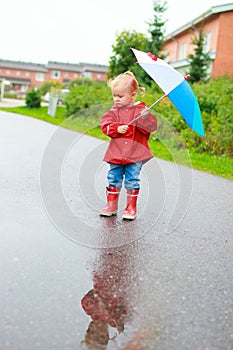 Toddler girl with umbrella