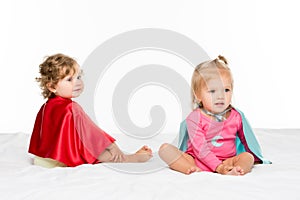 toddler girls in superhero capes