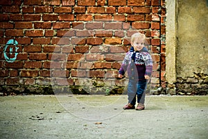 Toddler. Happy child outdoor. Smiling blond boy