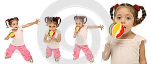 Toddler holding a lollipop wit