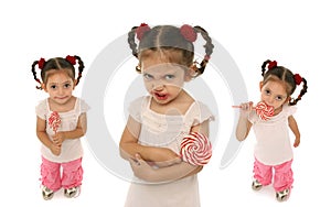 Toddler holding a lollypop wit