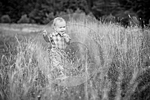 Toddler in a huge meadow