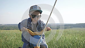 Toddler kid in funny glasses biking. Helping to ride a bike. Learning to ride a bike concept.