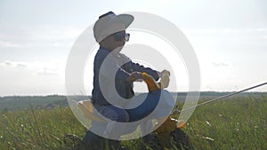 Toddler kid in funny glasses biking. Helping to ride a bike. Learning to ride a bike concept.