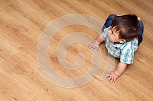 Toddler on laminate floor