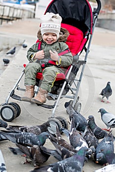 Toddler laughing baby in the stroller