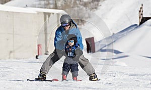 Toddler Learns to Ski with Dad. Safely Dressed