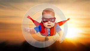 Toddler little baby superman superhero with a red cape flying th
