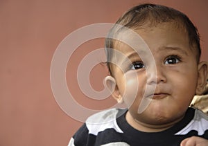 Toddler looking up happily