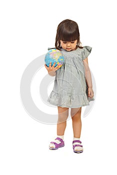 Toddler meditating and holding globe