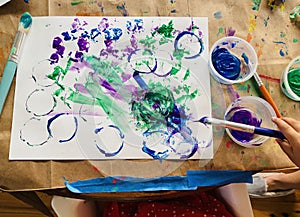 Toddler Painting at the Kitchen Table
