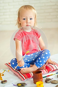 toddler paints with gouache