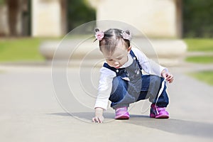 Toddler pirl playing outdoor