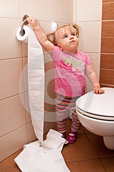Toddler playing in bathroom