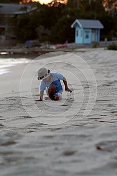 Toddler playing at the beach