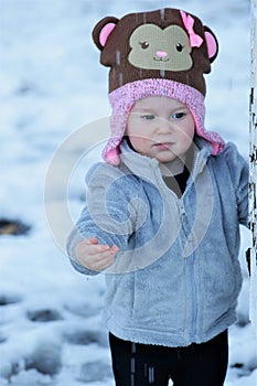 Toddler playing in falling water