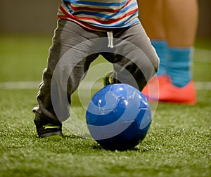 Toddler playing soccer