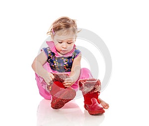 Toddler putting on shoes