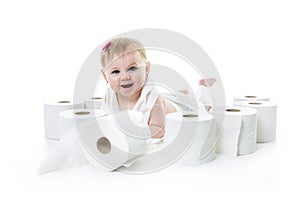 Toddler ripping up toilet paper in bathroom studio