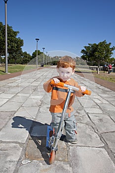 Toddler on Scooter in park