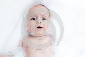 Toddler showing face just above water surface