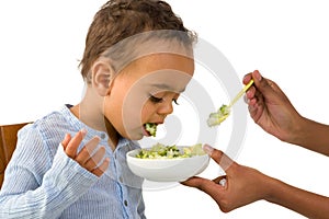 Toddler spitting out his vegetables