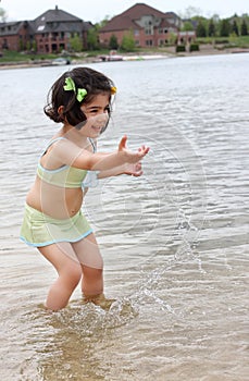 Toddler splashing water