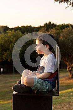 Toddler staring at the sunset