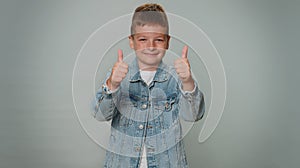 Toddler toddler stylish boy boy showing thumbs up and nodding in approval, successful good work