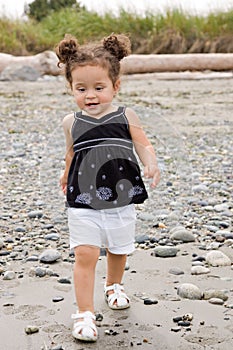 Toddler toddling on the beach